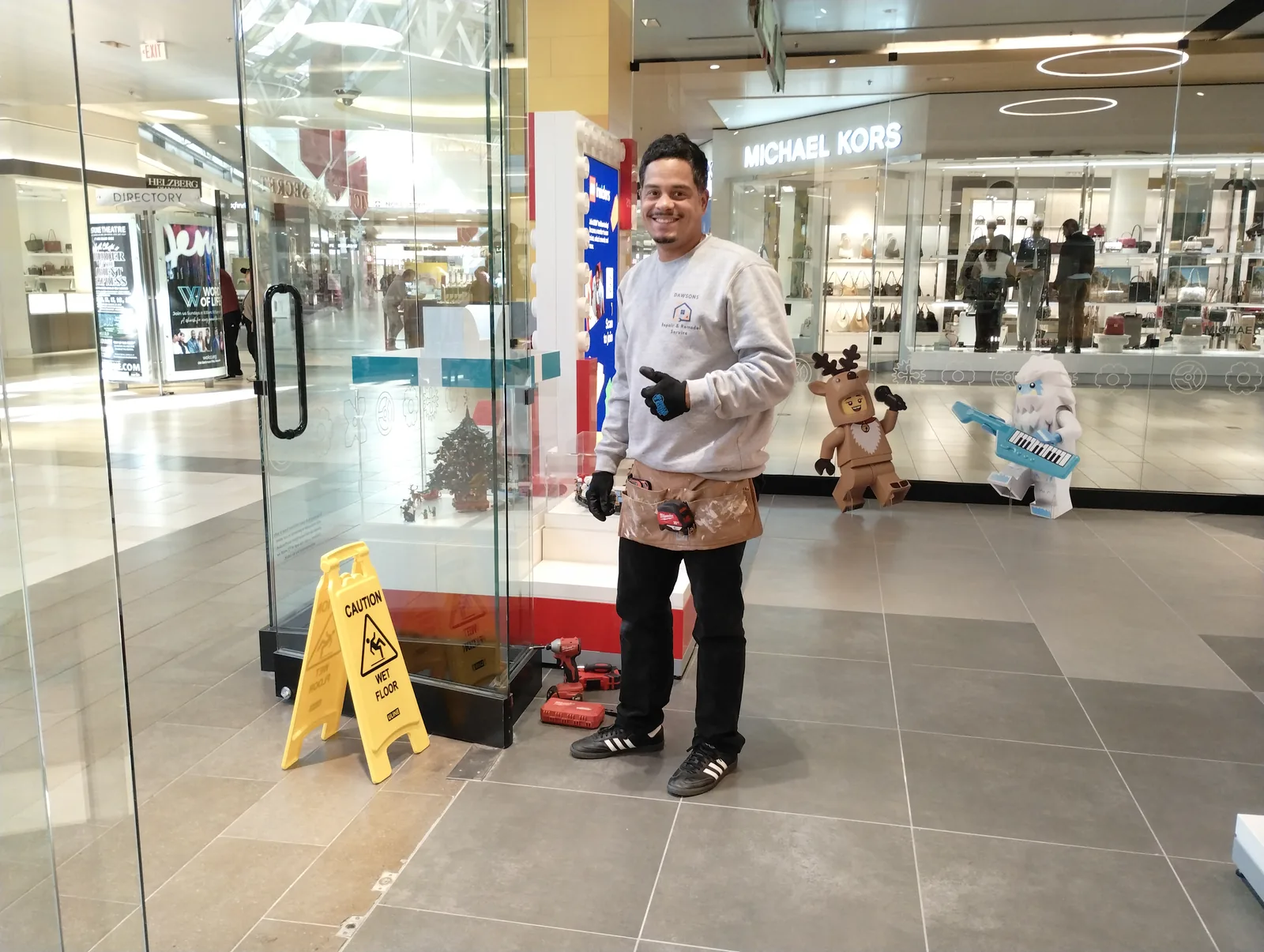 Dawsons technician performing maintenance inside a retail property