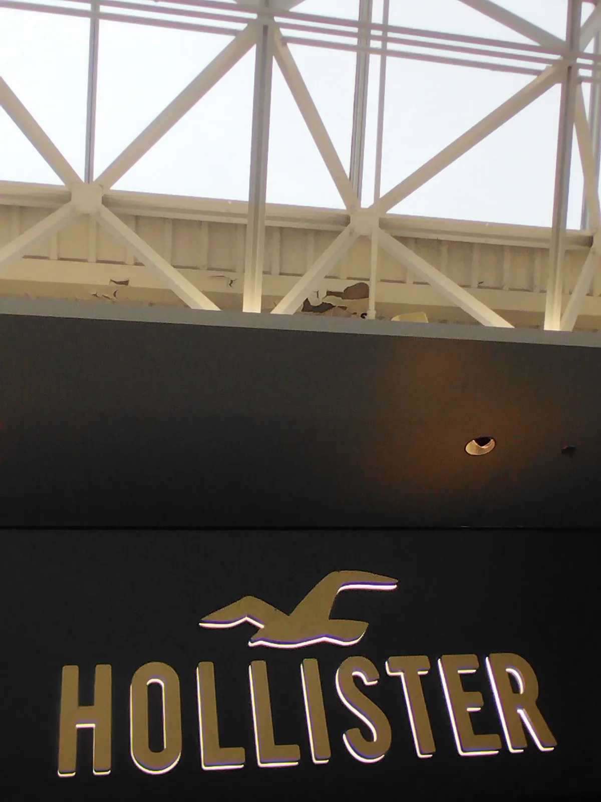 Commercial retail storefront sign and ceiling maintenance